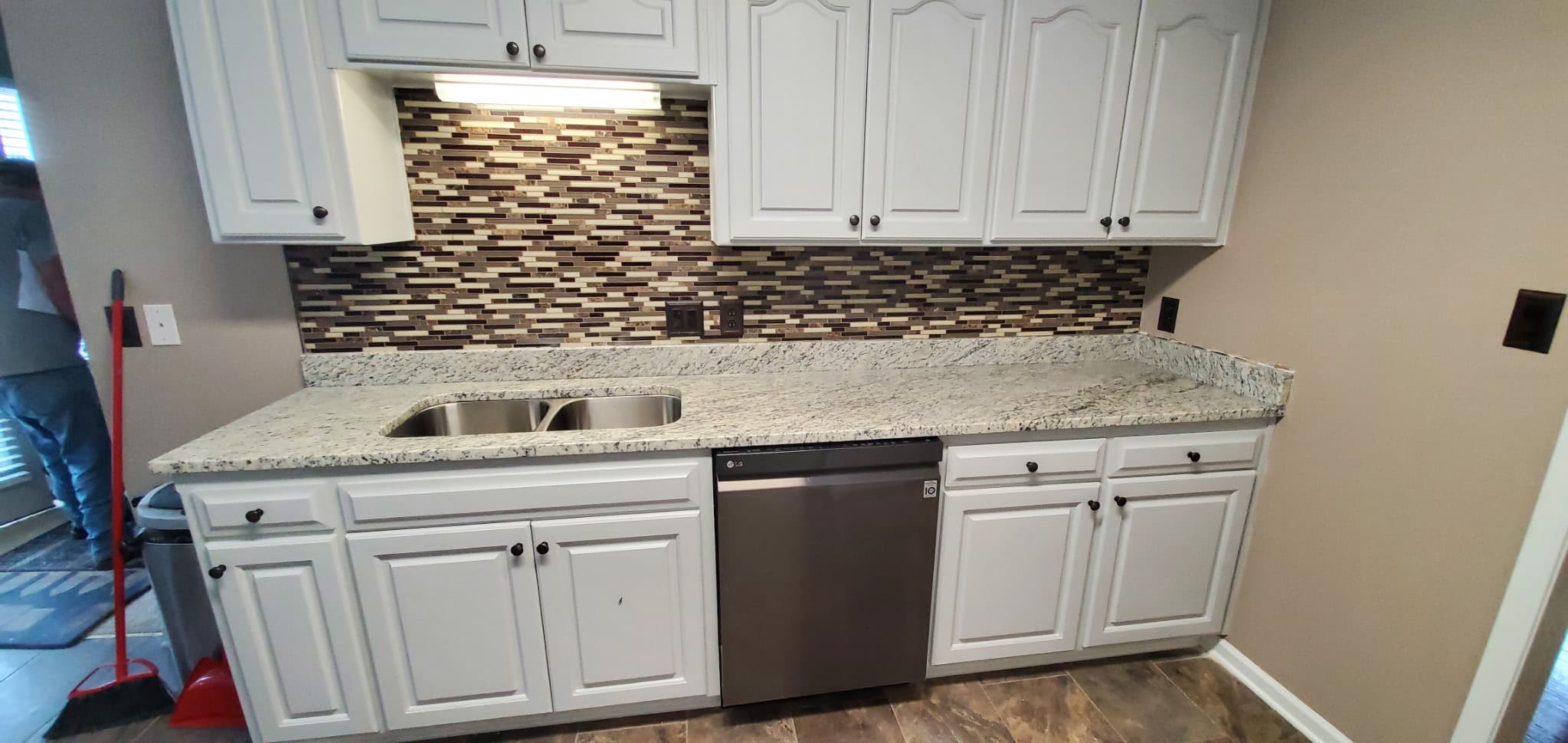 White granite kitchen counters with white cabinets